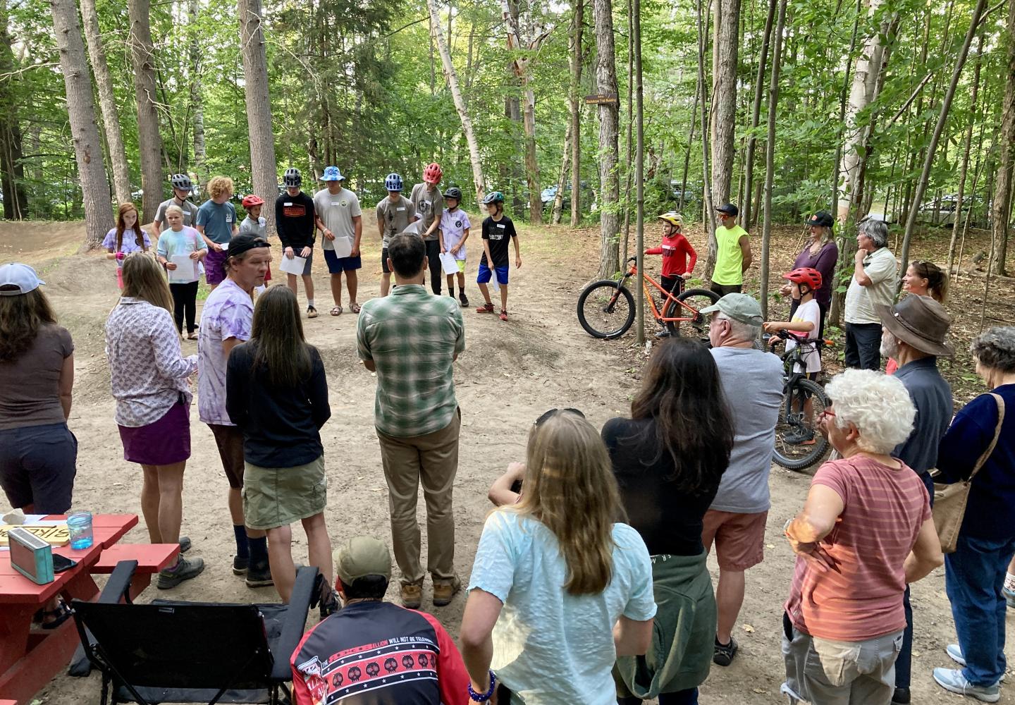 Locals gather to celebrate the grand opening of the new Town of Harrietstown Bike Park in Saranac Lake.