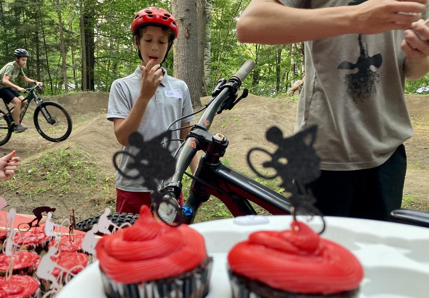 Local kids enjoy cupcakes at the opening of the new Town of Harrietstown Bike Park in Saranac Lake, NY.