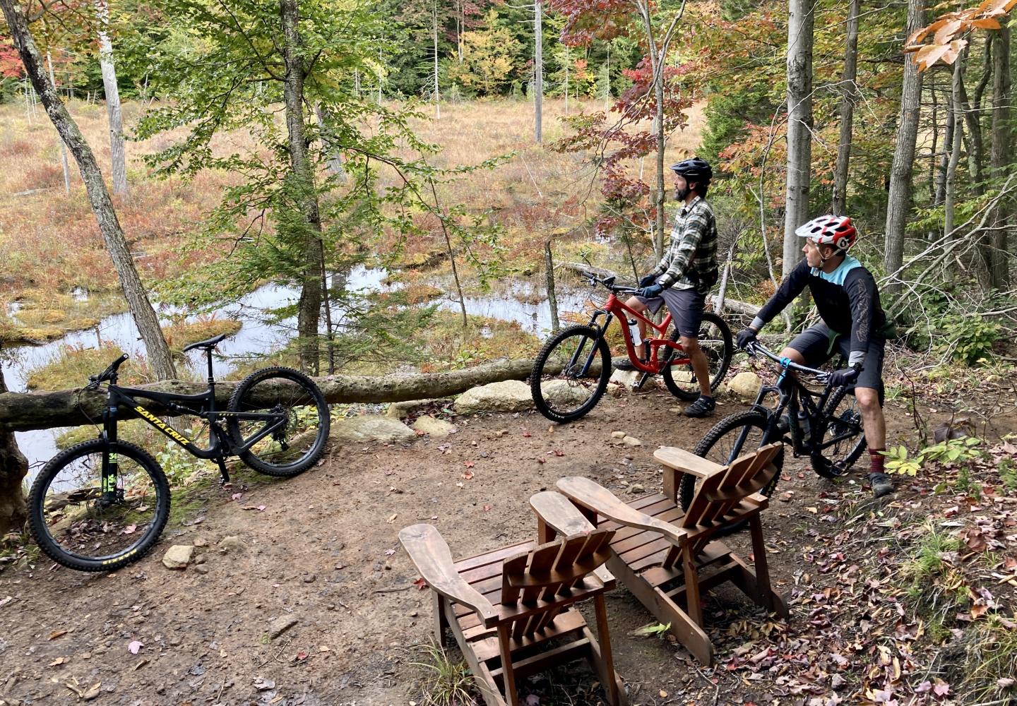 Mountain bikers take in the view at McCauley Mountain during the Adirondack Mountain Bike Festival