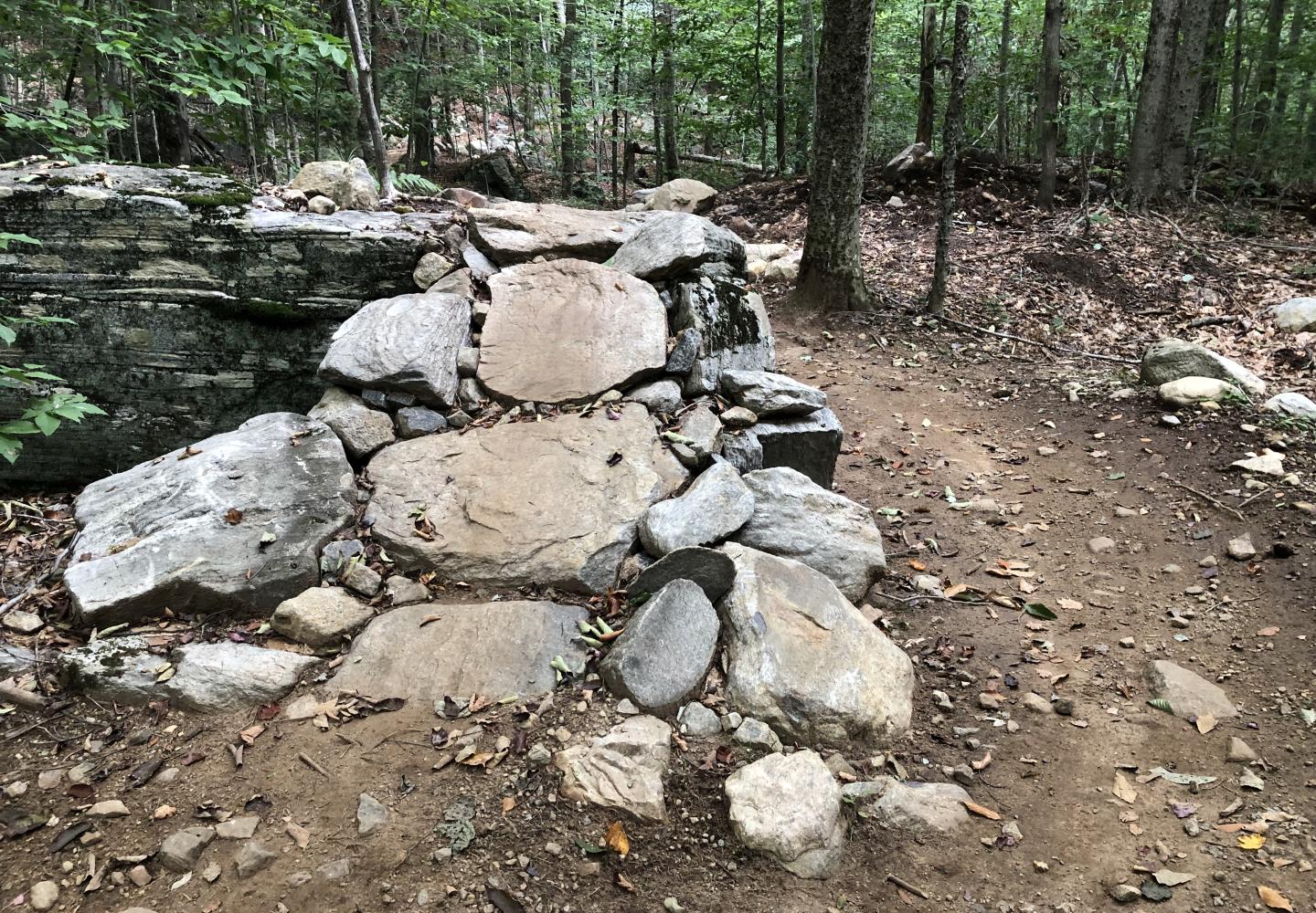 This stone jump is an example of the creative rock work found on the Wheelerville Trails.