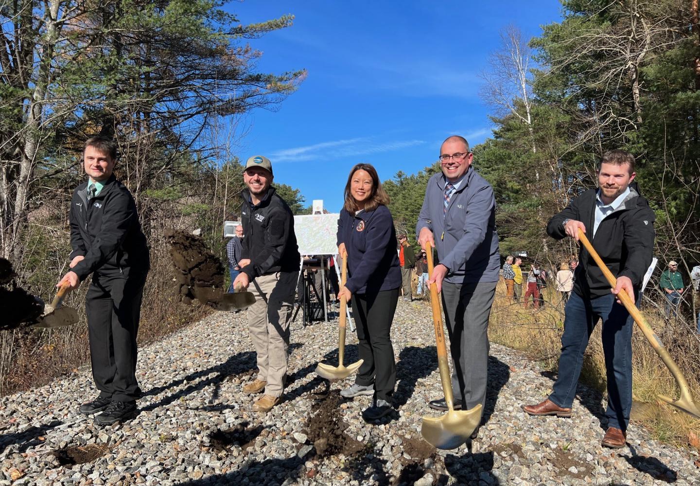 State officials came to Saranac Lake this week to open construction of the Adirondack Rail Trail. From left to right are Joe Zalewski, regional director of the Department of Environmental Conservation; Basil Seggos, environmental conservation commissioner; Jeanette Moy, Office of General Services commissioner; Steve Gagnon, a design engineer for the Department of Transportation; and Saranac Lake Mayor Jimmy Williams. Photo courtesy of NYSDEC.