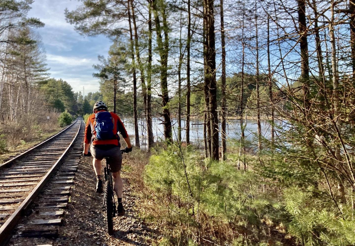 A cyclists pedals along the Adirondack Rail Trail before the rails were removed.