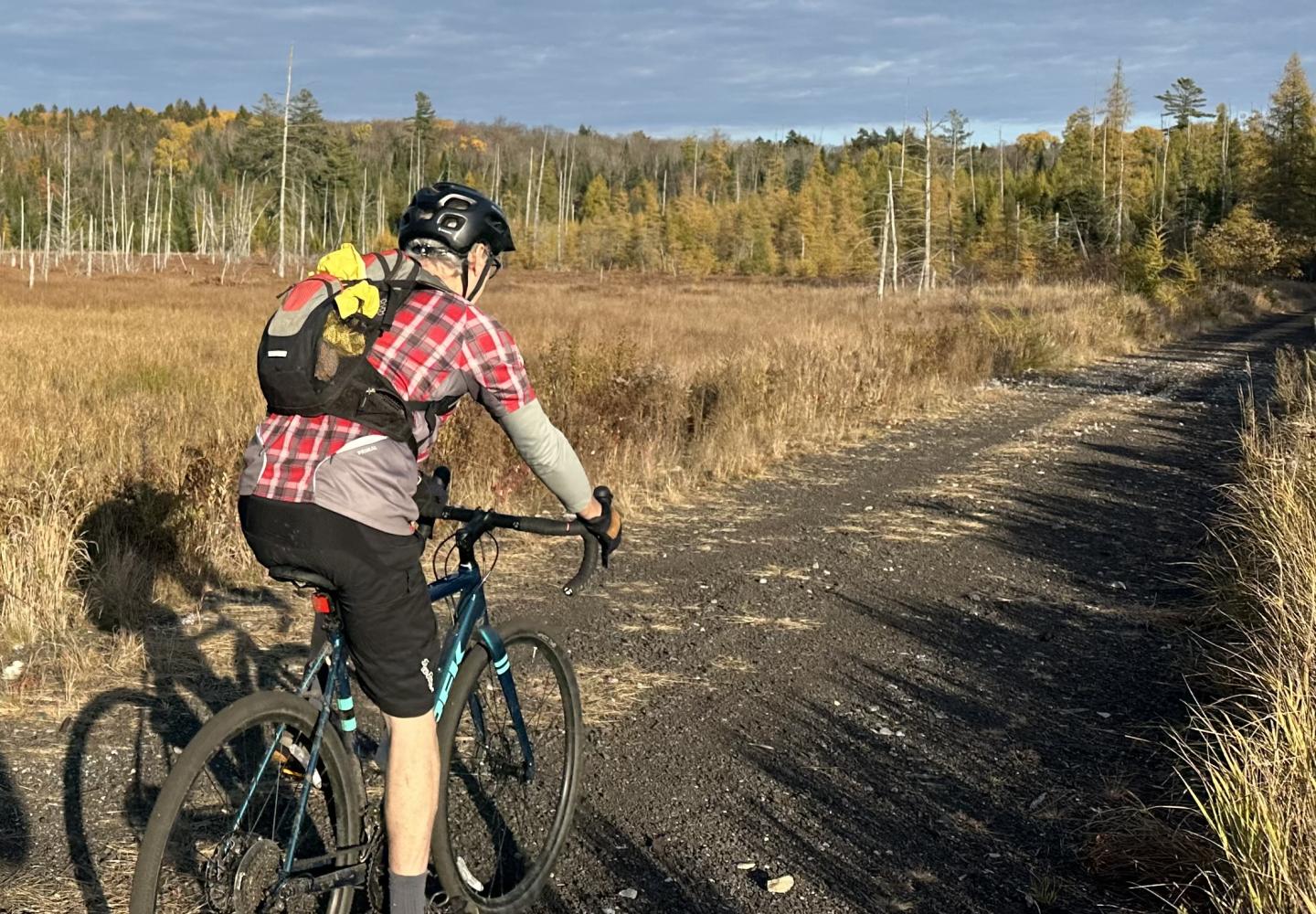 BikeADK blogger Phil Brown pedals a section of the unfinished Adirondack Rail Trail. 