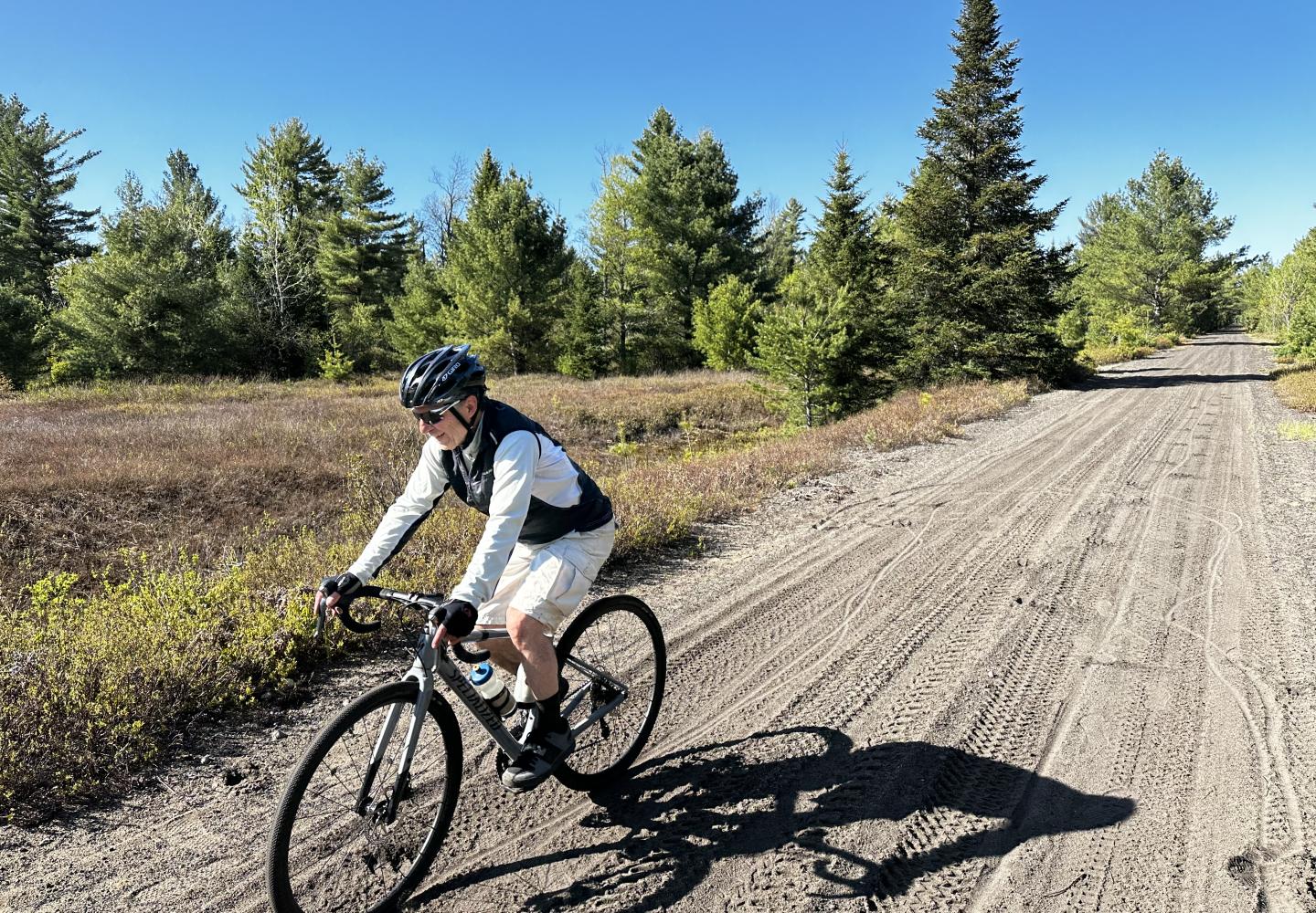 A cyclist rides toward Lake Clear on the former New York Central Railroad.