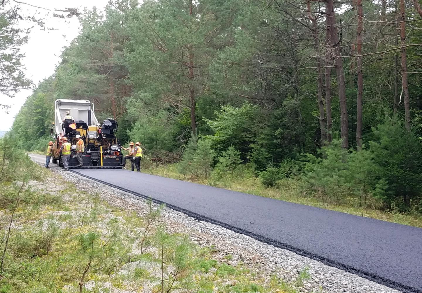 Paving of just over 2 miles of the Adirondack Rail Trail in Saranac Lake is underway.