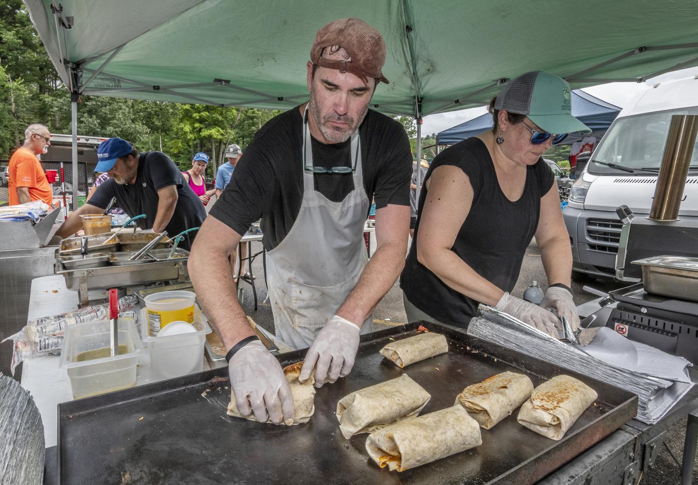 Grilling up fresh burritos on site.