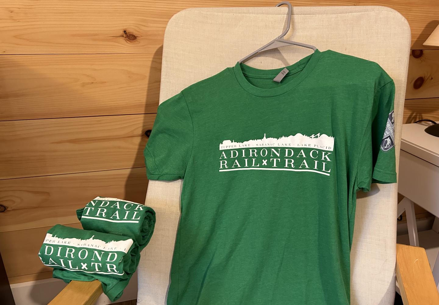 The purchase of Adirondack Rail Trail tee shirts supports youth cycling programs.