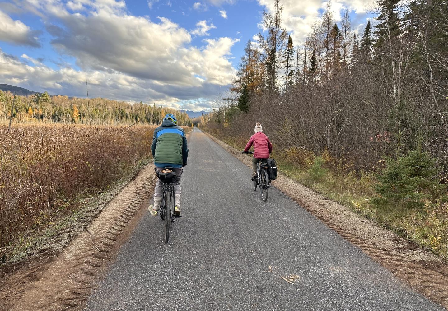 Cyclists ride the Adirondack Rail Trail between Saranac Lake and Lake Placid.