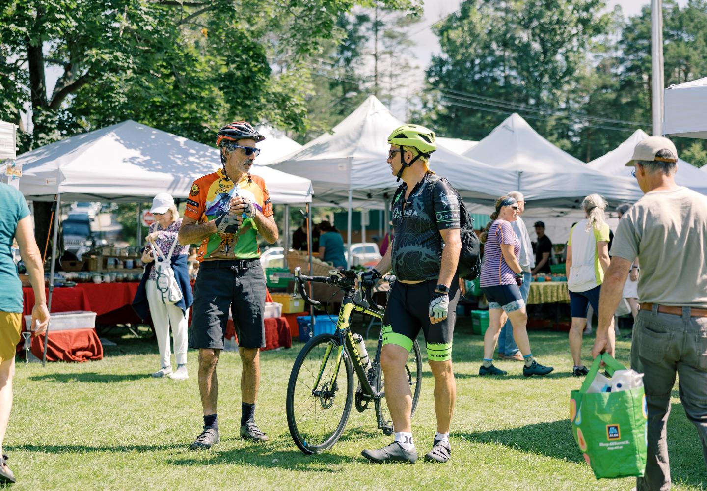 Cyclists enjoy a trip to the Saranac Lake Farmers' Market during the annual Weekender at Paul Smith's College three-day event.