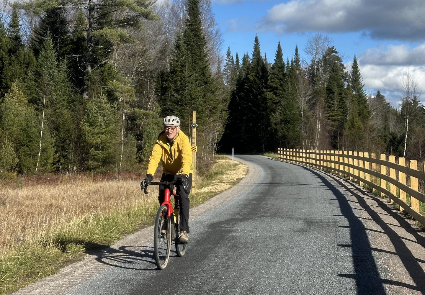 Phil Brown rides his bike on the Adirondack Rail Trail.