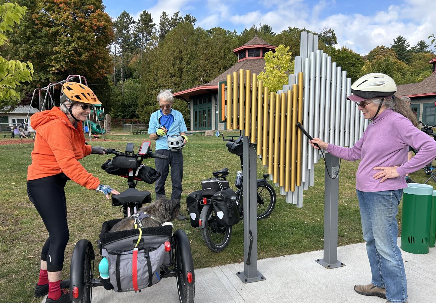 Cyclists play at the Adirondack Carousel during a ride on the Adirondack Rail Trail.
