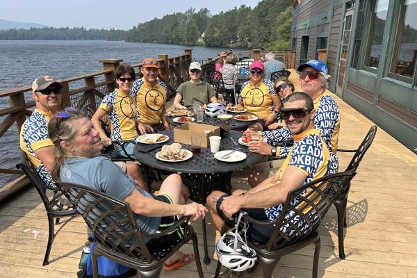 Roadies toasting the final ride with paninis and ice cream on the deck.